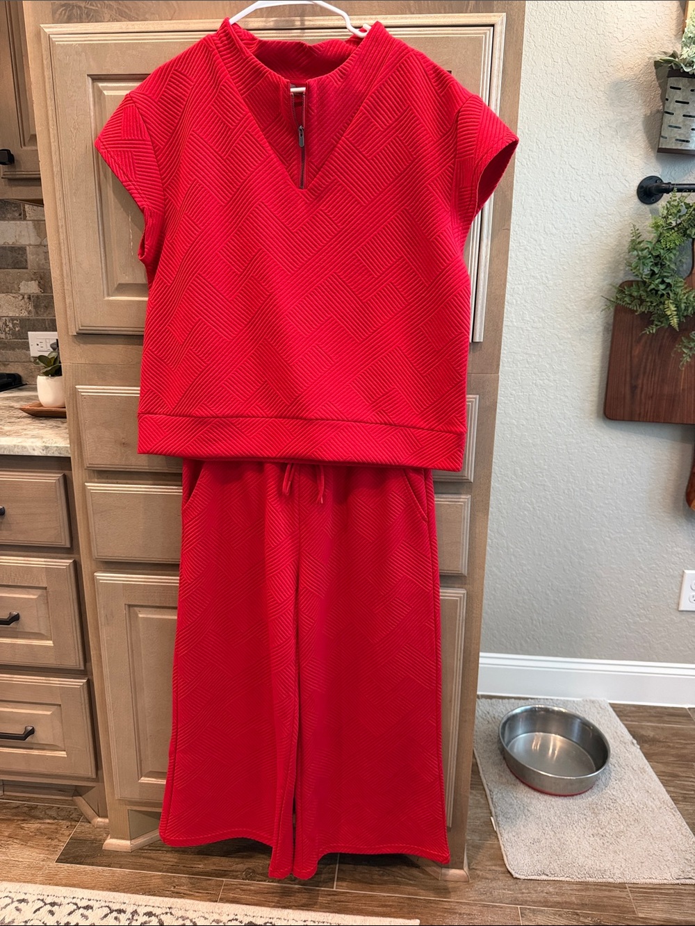 Red textured short sleeve top and wide leg ankle pants. Top is M, pants are L